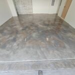 Metallic epoxy garage floor coating — edge detail